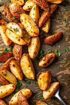 roasted potatoes with parsley on a baking sheet