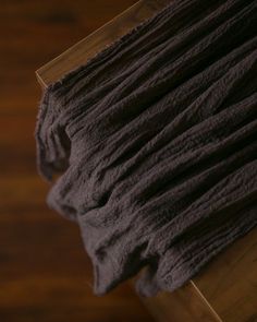 a piece of cloth sitting on top of a wooden table