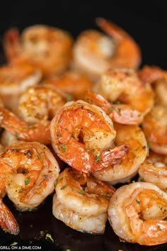 cooked shrimp is piled up on top of each other