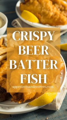 crispy beer batter fish on a white plate with lemon wedges and bread sticks