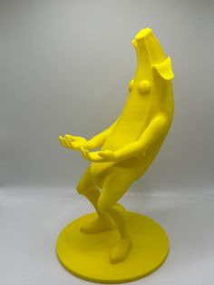 a yellow sculpture sitting on top of a table