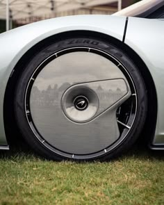 the front wheel of a silver sports car