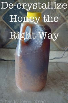 a gallon of honey sitting on top of a counter next to a tile wall with the words de - crystalalize honey the right way