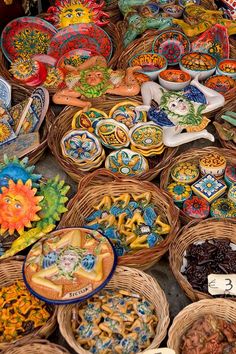 many baskets filled with different types of food on top of a table next to each other