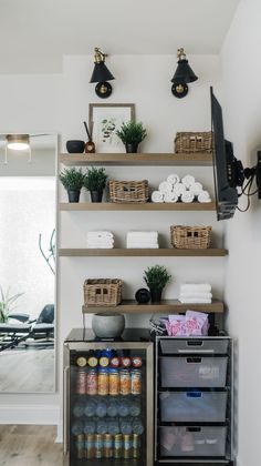 the shelves in this kitchen are filled with various items and things to put on them