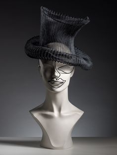 "You are looking at our limited edition selection of headpieces that are the result of Tatiana's creative bursts. Each headpiece is created using the finest handmade techniques and highest quality supplies. This is a interpretation of a top hat with a wire skeleton and crinoline. The wire work at the fron adds 20's Charlie Chaplin style to it.  It is a very unusual statement piece that will look amazing if you are going for a vintage inspired look!  It can be made in 3 colours: black, white and High Fashion Hats, Black Headpiece, Wire Skeleton, Art Deco Hats, Unusual Hats, Black Tie Optional, Vintage Headpiece, Couture Hats, Gold Headpiece