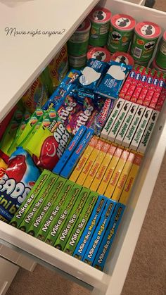 a drawer filled with lots of snacks and drinks