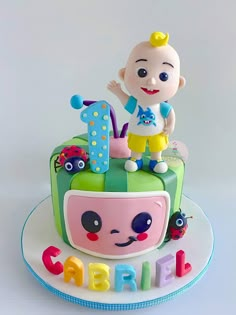 there is a cake that looks like a baby's first birthday