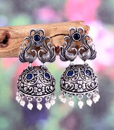 * Item  Description - * Material-  Silver plated Oxidised Earrings  * Weight -  28.00 Grams  * Inches -   2.0  Inches  * Length -  4.0 Centimeter  * Width -    2.0  centimeter  * Pattern -  Traditional wear, Party wear , Wedding gift, Daily wear, Casual Wear, birthday gift, anniversary gift ** Best price guaranteed ** We strive continuously to serve our customers better and keep updating our shop with new designs regularly .  We can also supply in wholesale quantities. To enquire about wholesale convo me .. Or e-mail at - hasnainansari198@gmail.com Please Contact Us for Bulk Orders. We will give you big discount on Bulk Quantity Orders.  To see more of our collection visit our shop  Seller Info: We are Aiming to supply best products to customers at best price. We believe good product nothi Festive Metal Temple Jewelry Earrings, Silver Temple Jewelry Chandelier Earrings With Latkans, Temple Jewelry Style Metal Chandelier Earrings, Metal Temple Jewelry Chandelier Earrings, Heavy Chandbali Pearl Earrings, Elegant Silver Danglers For Navratri, Oxidized Metal Earrings For Celebration, Metal Chandelier Earrings With Latkans In Temple Jewelry Style, Temple Jewelry Style Round Metal Earrings