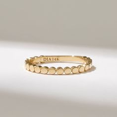 Embrace a touch of uniqueness with this Bold Dot Ring. Crafted from your choice of 14k, 18k, or 10k Solid Gold, this flat bead ring is a unique stacking ring for women. With its thumb-dotted design, it offers a distinctive and elegant look. It's a dainty everyday ring that adds a subtle touch of style to any occasion. 𝐈𝐭𝐞𝐦 𝐃𝐞𝐭𝐚𝐢𝐥𝐬 * Gold KT: 10K, 14K, 18K * Custom Gold Color: Rose Gold, Yellow Gold, White Gold * Width of Band: 2.16MM * Thickness of Band: 1.61MM ▶ Want to find out more 14k Gold Stackable Rings With Decorative Band, Ring Everyday, Dot Ring, Dainty Gold Rings, Midi Ring, Gold Flats, Everyday Rings, Gold Dots, Gold Ring Stack