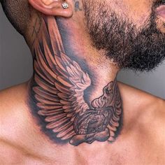 a man with a tattoo on his neck has an eagle and cross behind the neck