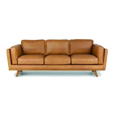 a tan leather couch with wooden legs and arms on an isolated white background, the back is