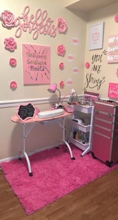 a room with pink rugs and decorations on the wall