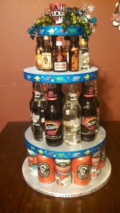 there is a three tiered display with beer bottles on it