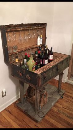 an old trunk filled with bottles and glasses