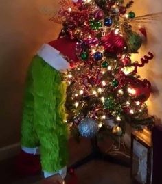 a christmas tree with lights and decorations on it