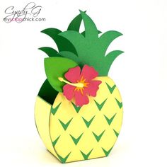 a paper pineapple with a flower in it