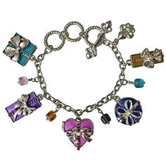 Charm Bracelets "Life's a Gift" - Bracelets For Women This very merry silvertone fashion accessory features a collection of festive presents that are tricked-out with beautiful bows, rhinestones, and colorful enamel. Additional strands of faceted beads are added into the mix, too, for a glamorous look. Adjust this bold toggle charm bracelet with the toggle clasp to a size that best suits you. Show your love for all things Christmas by wearing a little holiday cheer! Did someone say Christmas? Th Multicolor Bangle Charm Bracelet For Party, Metal Bracelet Jewelry Gift, Metal Bracelet Jewelry For Gifts, Adjustable Costume Jewelry Bracelet For Gift, Silver Holiday Jewelry Gift, Holiday Silver Jewelry Gift, Multicolor Metal Jewelry As A Gift, Multicolor Metal Jewelry For Gifts, Silver Jewelry For Holiday Gifts