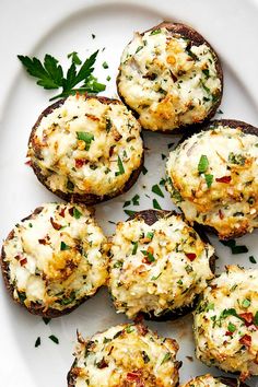 some food is on a white plate with green garnish and sprinkles