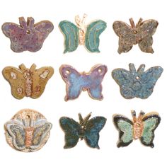 six different colored butterflies are shown in this image, one is gold and the other is blue