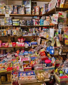 a store filled with lots of different types of food and snacks on shelves next to each other