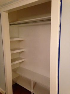 an empty white closet with no one in it