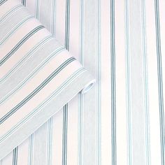 a close up view of a blue and white striped shirt