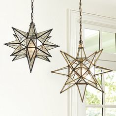 two star shaped lights hanging from the ceiling