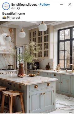 a kitchen with marble counter tops and wooden stools in front of an open window