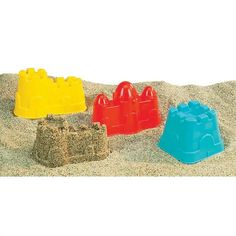 sand castle made out of plastic blocks in the sand