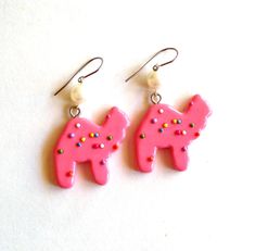 These earrings are so whimsical, girly and fun. The charms are so realistic you may think they are real cookies! Couture quality charms hang below sterling silver hooks and pink Swarovski crystals.I designed each of these animal cookie charms with great attention to detail in the signature white and pink colors. Each cookie has been frosted and decorated with tiny rainbow sprinkles. Choose between the following shapes: Camel or elephant and pink or white color. Charms will hang from Stainless St Funky Earrings Diy, Toybox Ideas, Pastel Clown, Circus Animal Cookies, Silly Earrings, Weird Earrings, Cookie Earrings, Circus Animal Cookie, Circus Cake