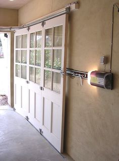 an image of a white door with glass on the front and side, attached to a wall