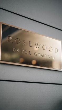 the rosewood hotel george sign on the wall