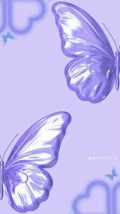 two purple butterflies flying in the sky