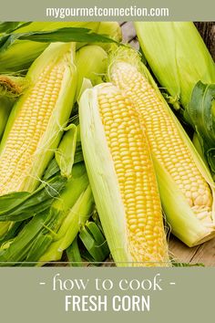 corn on the cob is sitting on a wooden table