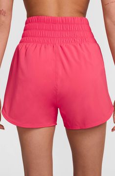 Gear up for your run with these lightweight high-waisted shorts constructed from moisture-wicking fabric and designed with brief lining for extra support. 3" inseam; 26" leg opening; 13 1/2" front rise; 17" back rise (size Medium) Elastic waist Side-seam pockets Dri-FIT moisture-wicking technology Brief liner 100% polyester Machine wash, tumble dry Imported Nike Athletic Shorts With Built-in Shorts And 4-way Stretch, Nike Athletic Shorts With Elastic Waistband For Gym, Nike Breathable Nylon Bottoms, Nike Nylon Running Shorts, Nike Running Nylon Shorts, Nike Activewear With Built-in Shorts For Summer, Nike Running Shorts Athleisure Style, Nike Activewear With Shorts For Summer, Nike Breathable Nylon Shorts