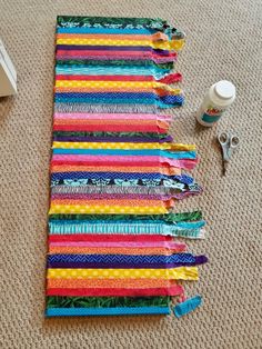 several strips of fabric laid out on the floor