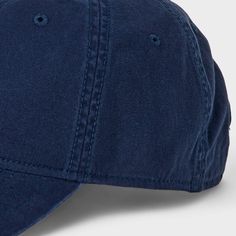 Refresh your warm-weather cap collection with this Cotton Baseball Hat from Goodfellow & Co™. Made from midweight cotton, this textured baseball hat features a curved brim to keep the sun out of your eyes along with embroidered eyelet holes on the head for better ventilation. The back tuck and slide closure completes the design with a customizable fit. Goodfellow & Co™: Where style & fit are always in good company. Blue Cotton Hat With Curved Brim, Blue Cotton Baseball Cap For Outdoor, Navy Baseball Cap For Summer Outdoor, Classic Baseball Cap For Spring Outdoor, Outdoor Blue Cotton Baseball Cap, Casual Blue Fitted Hat With Curved Brim, Blue Cotton Baseball Cap, Blue Cotton Hats With Curved Bill, Blue Cotton Adjustable Baseball Cap