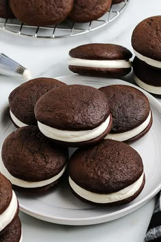 chocolate sandwich cookies with cream filling on a plate