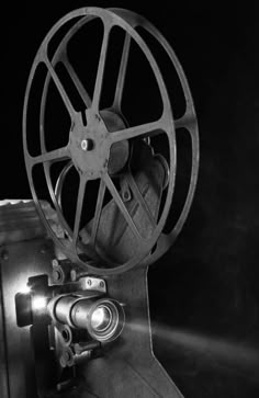 a black and white photo of a movie projector