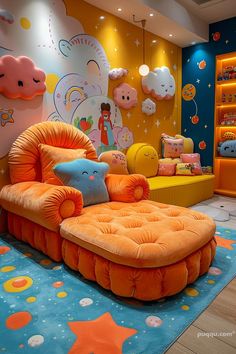 the children's room is decorated in bright colors and features an orange couch, yellow chair, and blue rug