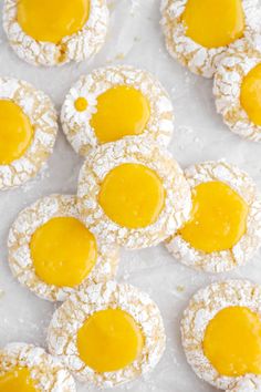 powdered sugar covered cookies with yellow icing