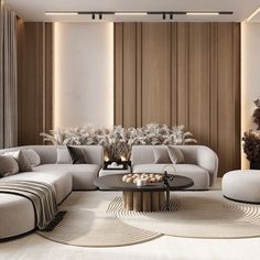 a modern living room with white couches and round tables