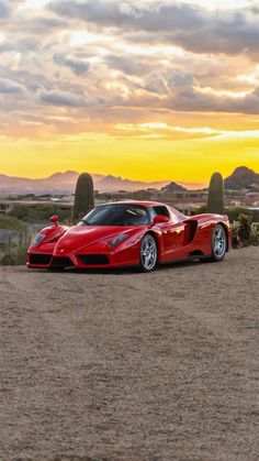 a red sports car parked in the desert