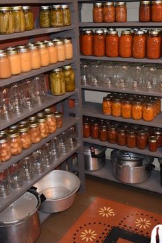 the shelves are filled with many jars and pans full of different types of food