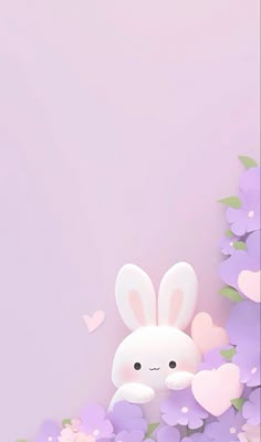 a cute bunny sitting in the middle of purple flowers