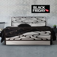 a black and white bed in front of a brick wall with the words black friday on it