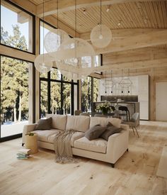 a living room filled with furniture and lots of windows