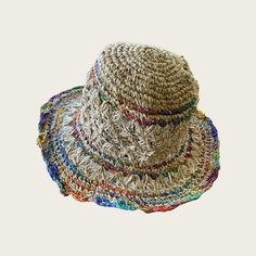 "Organic Hemp Crochet Sun Hat - Multi-Color, Rainbow Our 100% handmade crocheted sun hats are made from pure hemp yarn from Nepal. Perfect for summer...at the beach, pool, festival or just hanging around. They come in one size which fits most! As with many 100% hemp products they maybe slightly stiff, but soften and stretch over time. Features: - 100% Hemp hat and handmade in Nepal - It has wire in the rim means you can shape the hat however you desire and flat pack it for easy storage or travel Bohemian Yarn Bucket Hat For Festival, Crochet Natural Sun Hat For Vacation, Woven Cap For Beach, Lightweight Crochet Cap For Vacation, Natural Crochet Sun Hat For Vacation, Straw Cap Hat For Beach, Bohemian Hand-knitted Yarn Bucket Hat, Beach Woven Cap, Multicolor Brimmed Crochet Hat For Outdoor