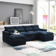 a living room with a blue sectional couch